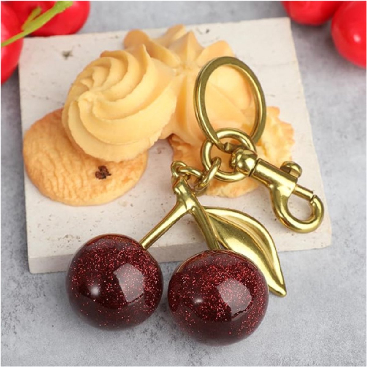 Coach cherry bag charm - België