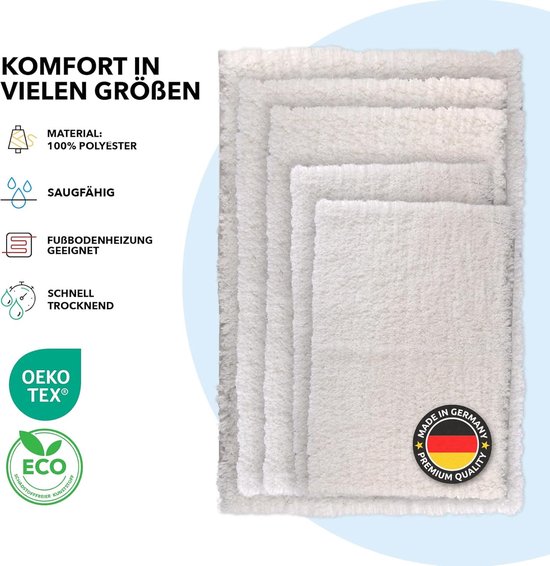 Trois tapis de bain de couleur crème de différentes tailles empilés, avec des informations sur le matériau et les caractéristiques.