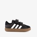 Zwarte Adidas sneakers met witte strepen en klittenbandsluiting, bruine zool.