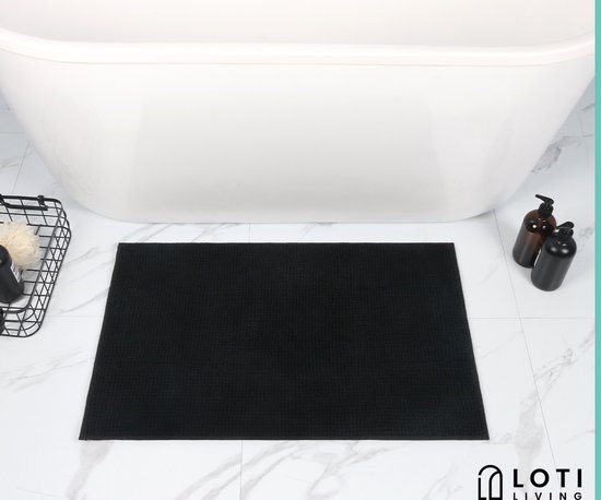 Zwarte, absorberende badmat voor de badkamer.