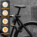 Zwart kettingslot met een lengte van 120cm, bevestigd aan een fiets. Bevat gele details en 3 sleutels.