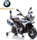 Witte politiemotor met BMW logo, "POLIZEI" opschrift, zijwieltjes, zwaailicht en grote banden.