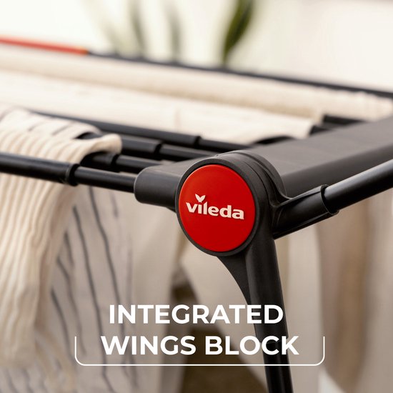 Close-up detail van de Vileda Infinity Flex droogrek, met "integrated wings block" tekst.