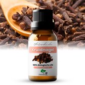 Glazen flesje met kruidnagelolie, etiket met 'Kruidnagel etherische olie'. Houten lepel en kruidnagels op achtergrond.