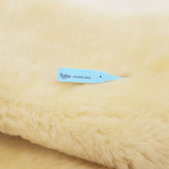 Peau de mouton médicale pour fauteuils roulants et scooters avec fermeture élastique - Skéépe - peau de mouton médicale Texel