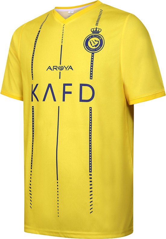 Gele voetbalshirt met V-hals en clublogo op de borst. Blauwe verticale strepen en stippellijnen aan de zijkanten, met logo 'KAFD'.