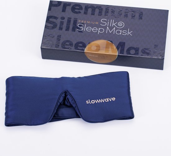 Donkerblauw Slowwave slaapmasker en verpakking met de tekst 'Premium Silk Sleep Mask'.
