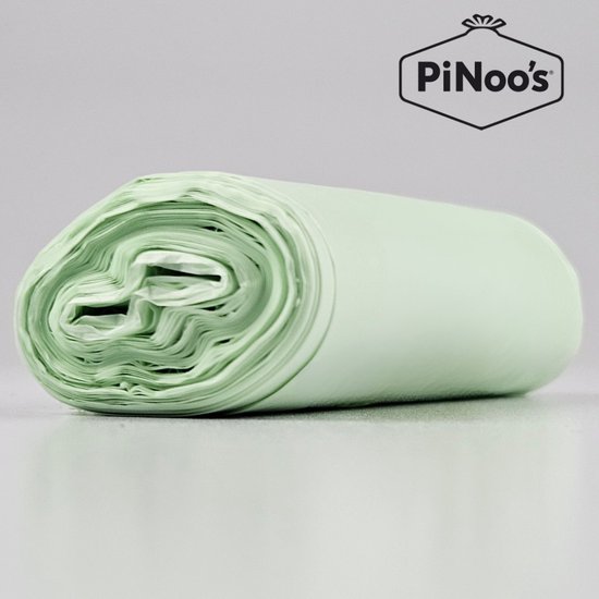 Close-up van een rol lichtgroene, biologisch afbreekbare afvalzakjes. De zakjes hebben een dikte van 19 my.