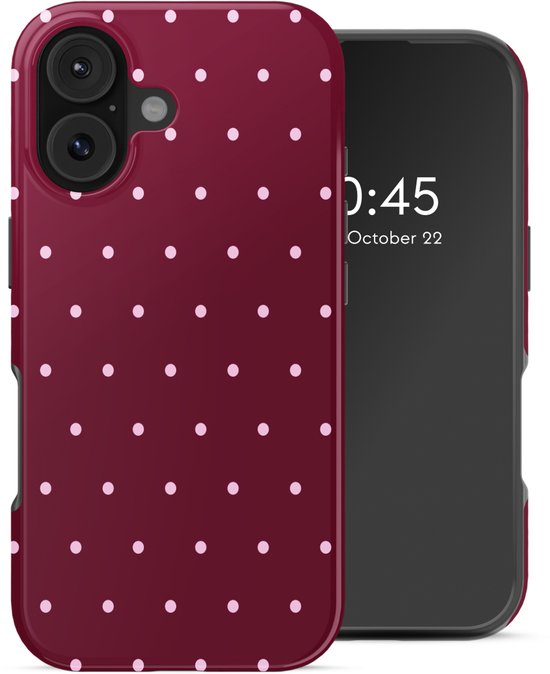 Coque de téléphone bordeaux à pois blancs à côté d'un smartphone.