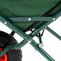 Detailopname van het metalen frame en de groene stof van de opvouwbare kruiwagen.
