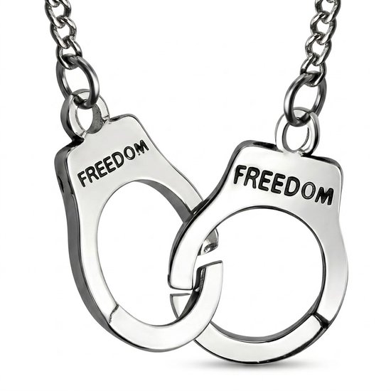 Deux menottes argentées gravées 'FREEDOM', reliées par une chaîne.