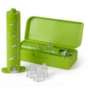 Groene Venomkiller extractor met vier opzetstukken in een open groene koker.