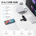Hub USB Sounix 4-en-1 noir, connecté à un ordinateur, avec des ports USB pour un appareil, un clavier et une carte SD. À côté d'un Google Home Mini.