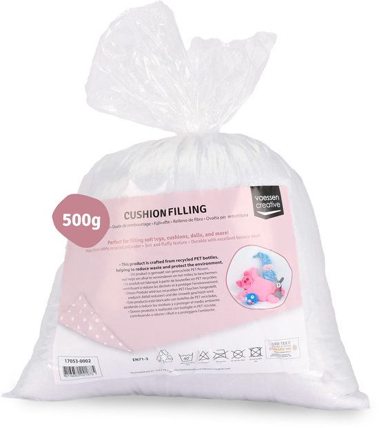 Zak met 500g witte polyester kussenvulling van Vaessen Creative, met afbeelding van een roze varken en gehaakte figuren.