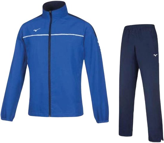 Blauw trainingspak van Mizuno voor kinderen, met een witte streep over de borst van het jack en een wit logo op het jack en de broek.