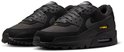 Zwarte Nike Air Max 90 sneakers met gele details en veters.