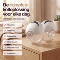 Twee witte Zookie draadloze borstkolven op een houten tafel met een stapel kleding.