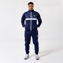 Man in een donkerblauw trainingspak met geometrisch patroon, FFF-logo, en witte strepen op de jas en broek.