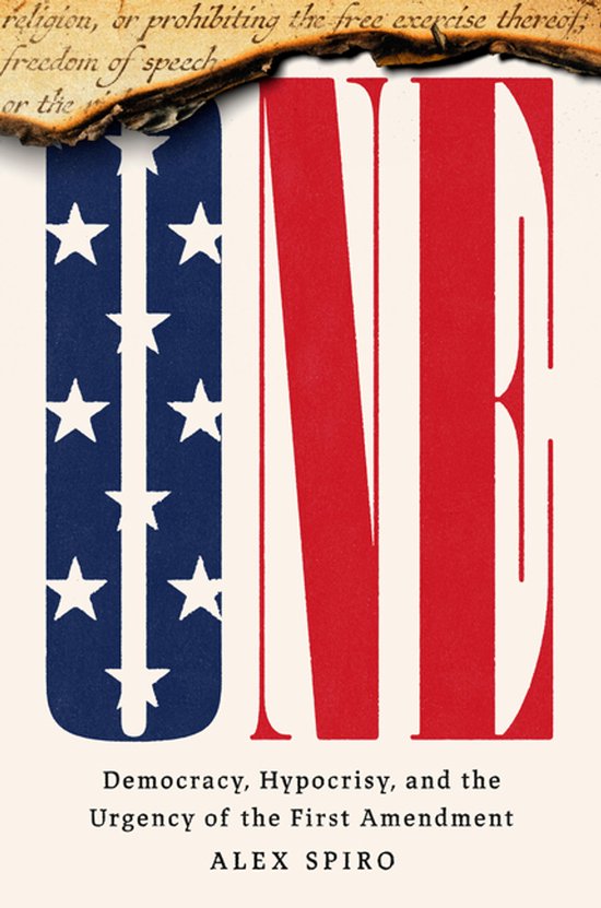 Couverture du livre 'ONE'. Le 'U' arbore le drapeau américain avec du fil barbelé. En haut, un extrait du 1er Amendement.