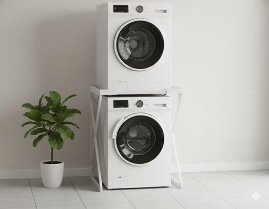Wit wasmachine-opbouwmeubel met een wasmachine en droger, naast een plant.