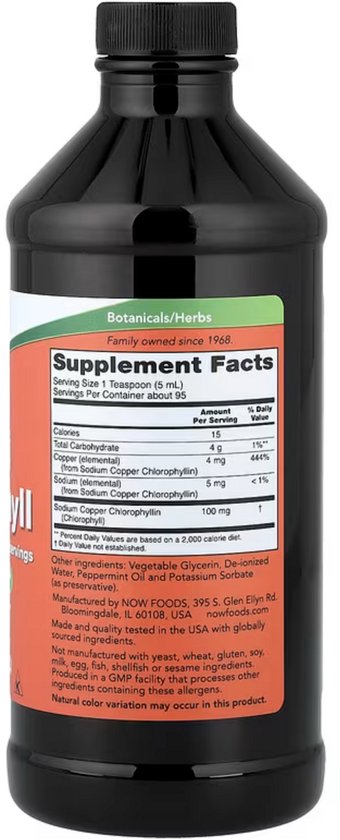 Achterkant van de zwarte fles met "Supplement Facts" etiket. Bevat voedingsinformatie, ingrediënten en waarschuwingen.