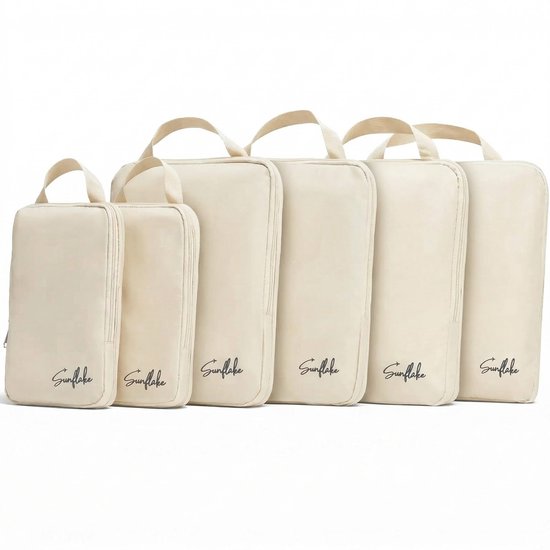 Reeks van vijf beige Sunflake packing cubes op een witte achtergrond.