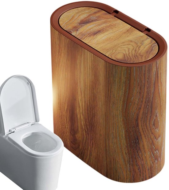 Ovalen afvalbak met houtlook en bruin deksel, naast een toilet.