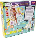 Achterkant speldoos 'Ik leer het menselijk lichaam' met anatomie en spelbeschrijving.