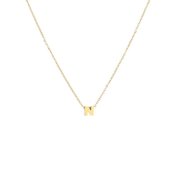 Collier doré avec un pendentif en forme de lettre 'N' minuscule.