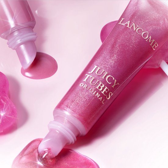 Lancôme Juicy Tubes Original lipgloss tube met een sprankelende, helder roze kleur en glinsterende druppels.