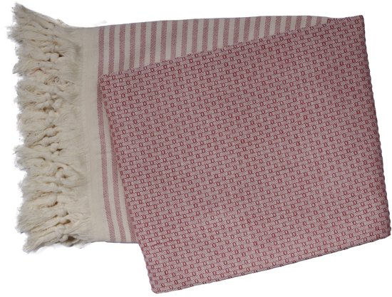 Fouta rayé rouge et blanc avec un motif à carreaux, franges et plié.
