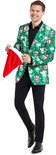Man met een groen kerstcolbert met lama's, toont kerstmuts