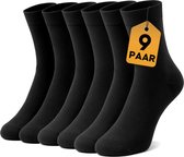 Zes paar zwarte VOLQU sokken met een gele tag '9 Paar'.