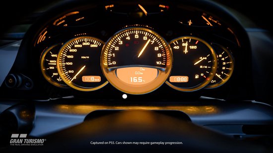 Dashboard van een auto met verlichte meters en een temperatuurweergave.