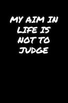 My Aim In Life Is Not To Judge�: A soft cover blank lined journal to jot down ideas, memories, goals, and anything else that comes to mind.