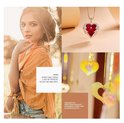 Model met gouden ketting met rood hartvormig kristal, omringd door vleugels. Text: Every girl needs a set of jewelry to set off her own.