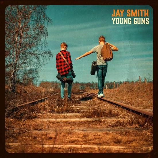Twee jongens lopen over een spoorlijn, "JAY SMITH YOUNG GUNS" staat bovenaan.