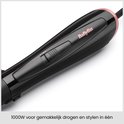 Brosse soufflante BaByliss noire avec détails en or rose, 1000W pour sécher et coiffer facilement.
