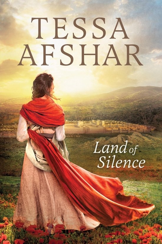 Livre 'Land of Silence' de Tessa Afshar. Femme en longue robe rose et châle rouge dominant une vallée avec des bâtiments et un coucher de soleil.