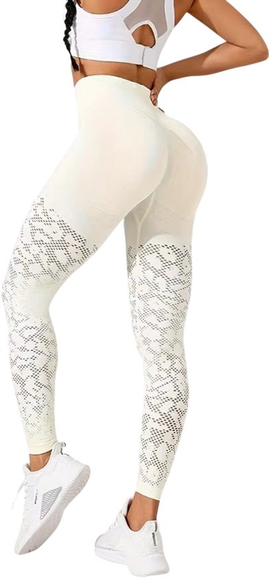 Beige sportlegging met hoge taille, mesh-details op de onderbenen en een heupliftend effect.