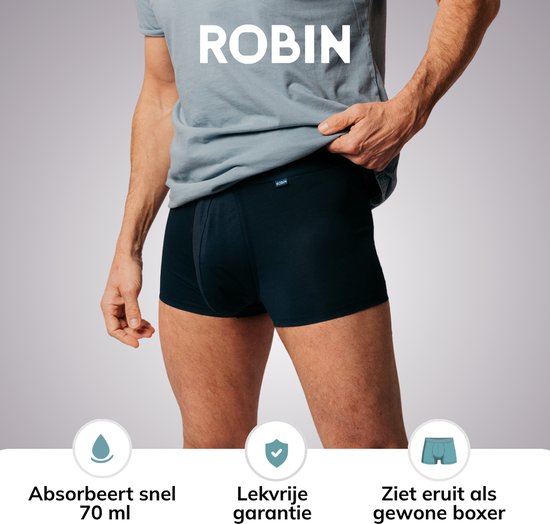 Man in donkerblauwe Robin boxershorts. Beschreven als "Absorbeert snel 70 ml", "Lekvrije garantie" en "Ziet eruit als gewone boxer".