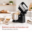 Zwarte Broba handmixer met metalen mengkom die deeg kneedt in een keukenomgeving.