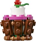 Een LEGO cupcake met bruine chocolade blokjes, roze rand en witte topping.