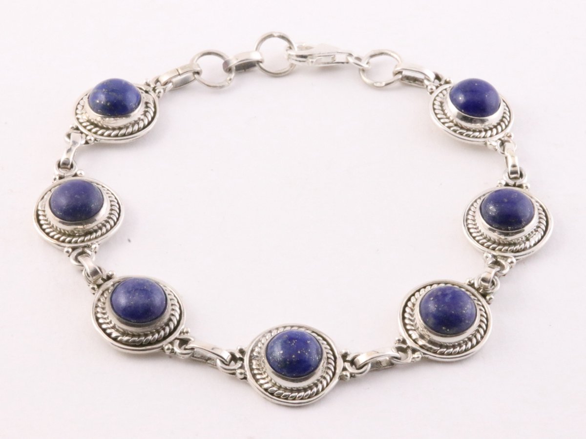 Bewerkte zilveren schakelarmband met lapis lazuli