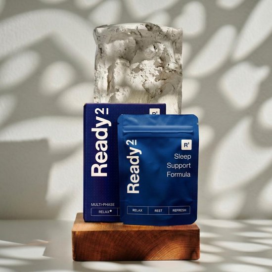 Blauwe verpakking van Ready2 Sleep Support Formula, met teksten en logo.
