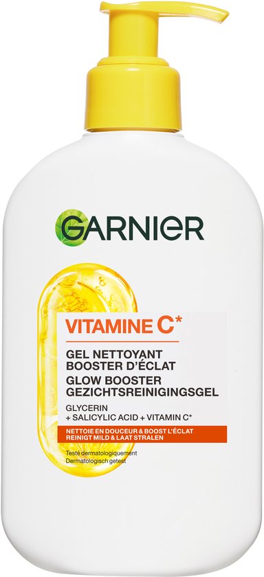 Witte fles Garnier Vitamine C gezichtsreinigingsgel met gele pomp en illustratie van een glanzende citroen.