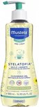 Mustela Stelatopia Cleansing Oil, 500 ml fles met pompje, met zonbloem-motief.