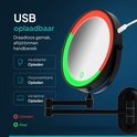 Zwart, rond led make-up spiegel met USB-oplaadpoort en rode en groene oplaadindicatoren.