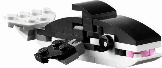 Een orka van zwarte en witte LEGO-stenen, met roze tanden en een vin.