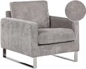 Grijze corduroy fauteuil met close-up van stoftextuur en verchroomde metalen poten.